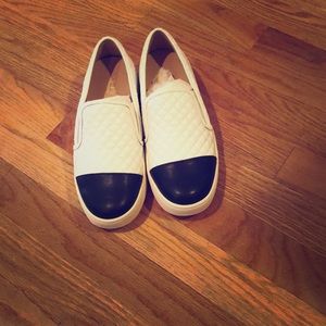 J/Slides slip on sneakers.